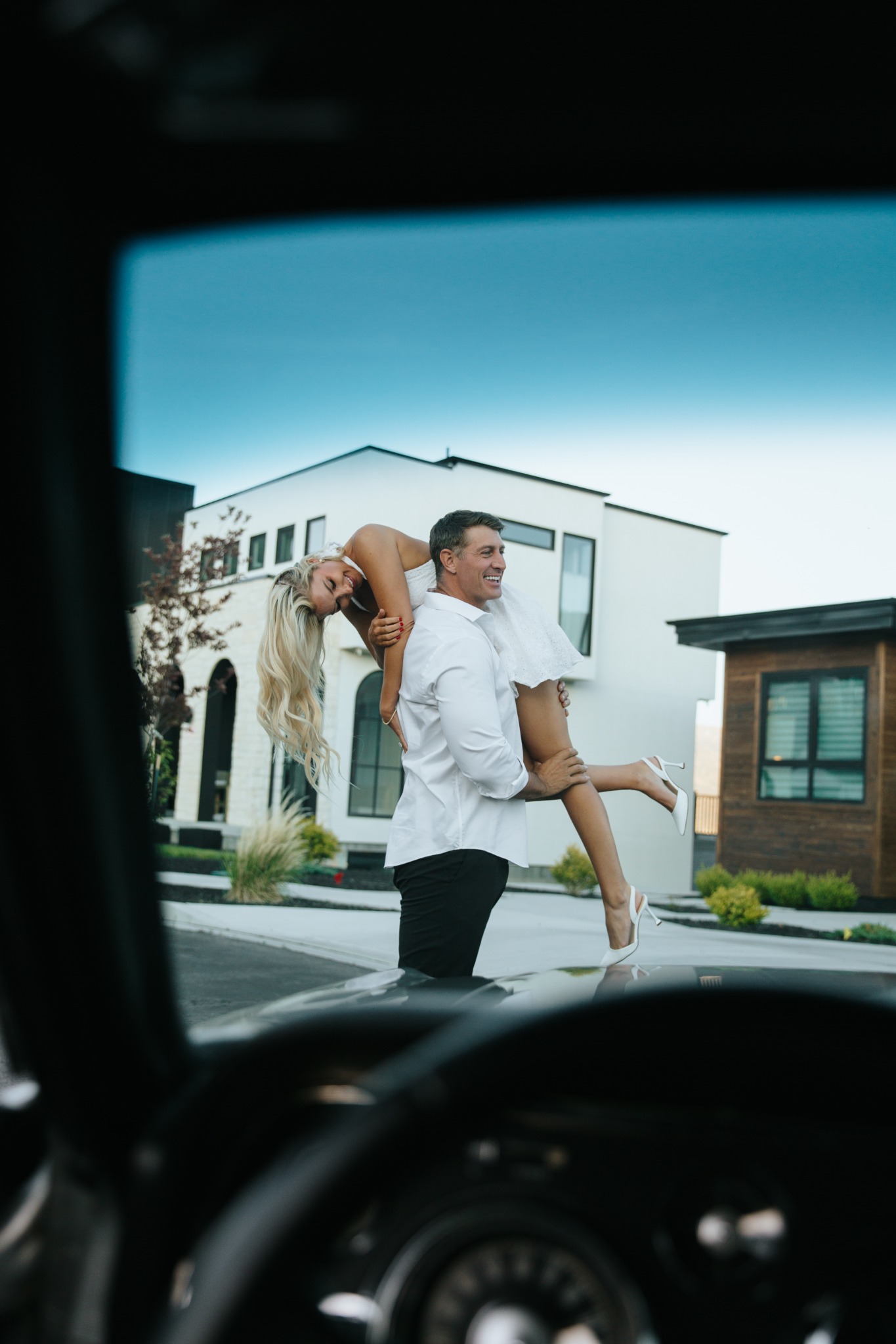 Devin carrying Summer over his shoulder