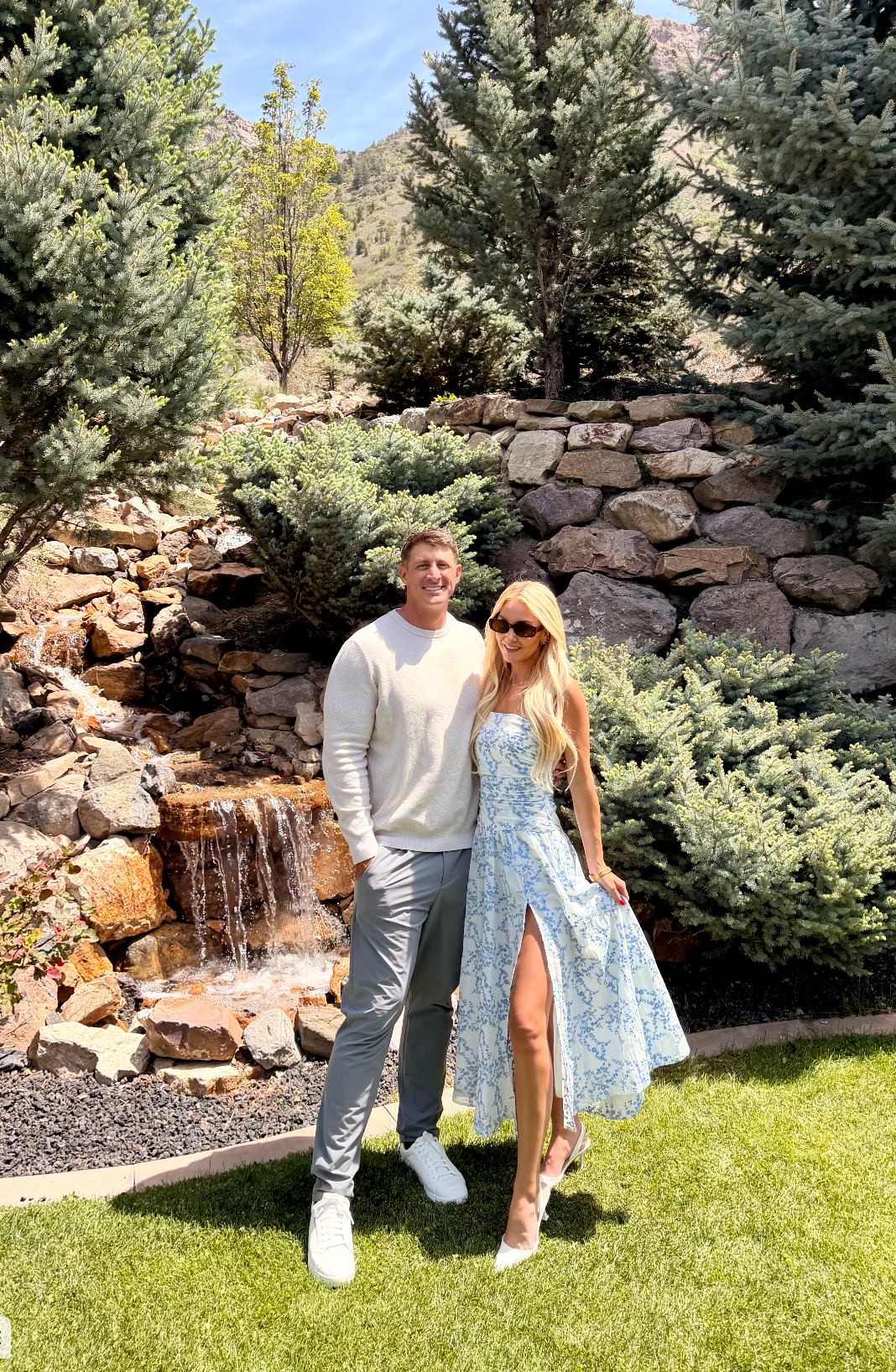 Devin and Summer together beside a mountain waterfall