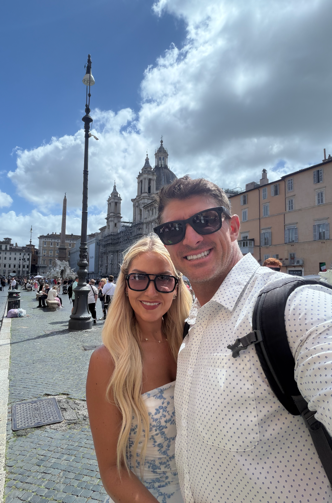Devin and Summer exploring a sunny piazza in Rome